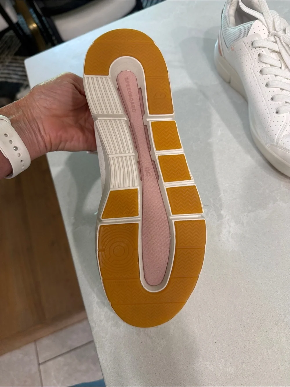 On Cloud . The Roger  Women's Perforated Leather Sneakers